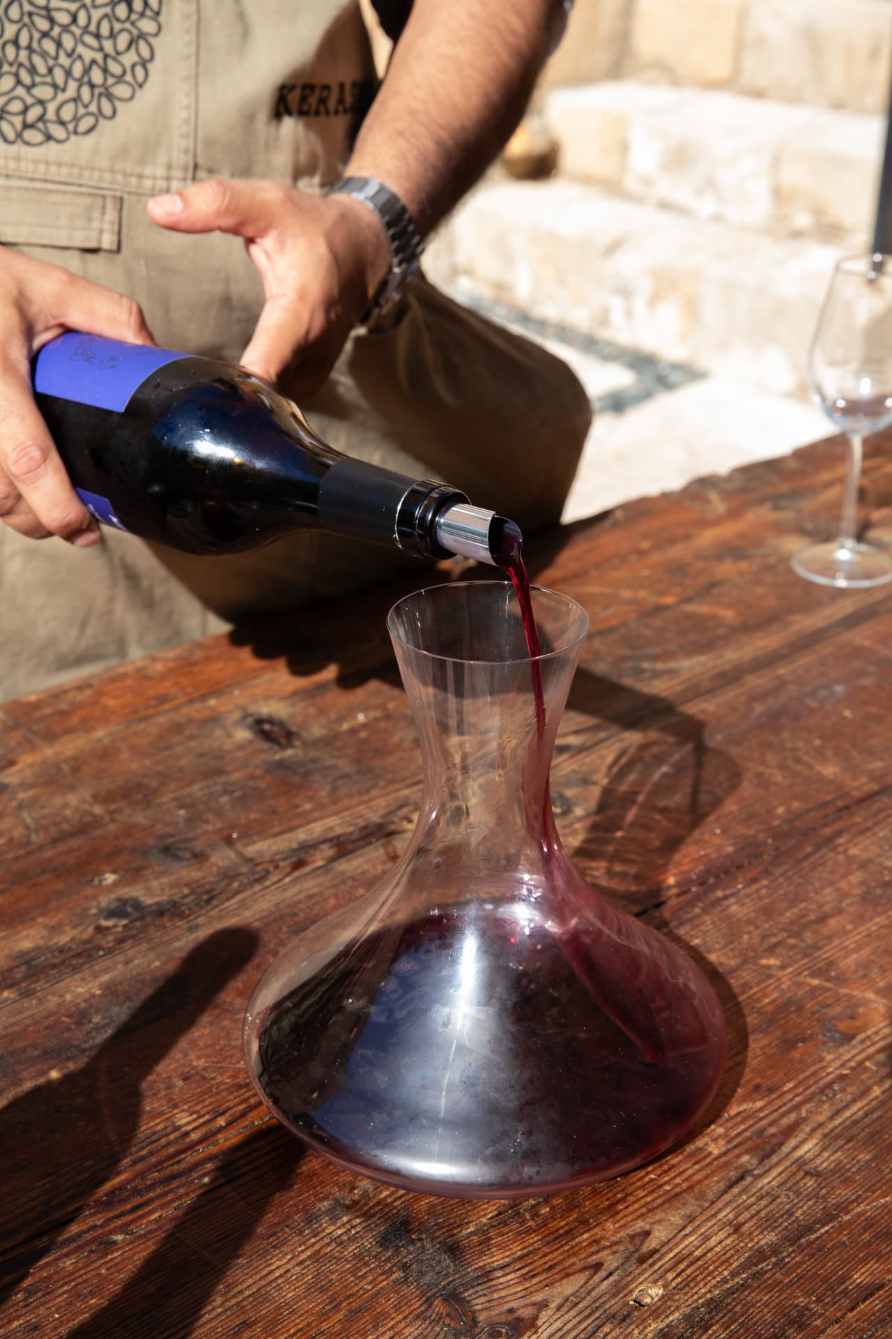 A wine tasting poured in the courtyard at Vasilikos Mansion